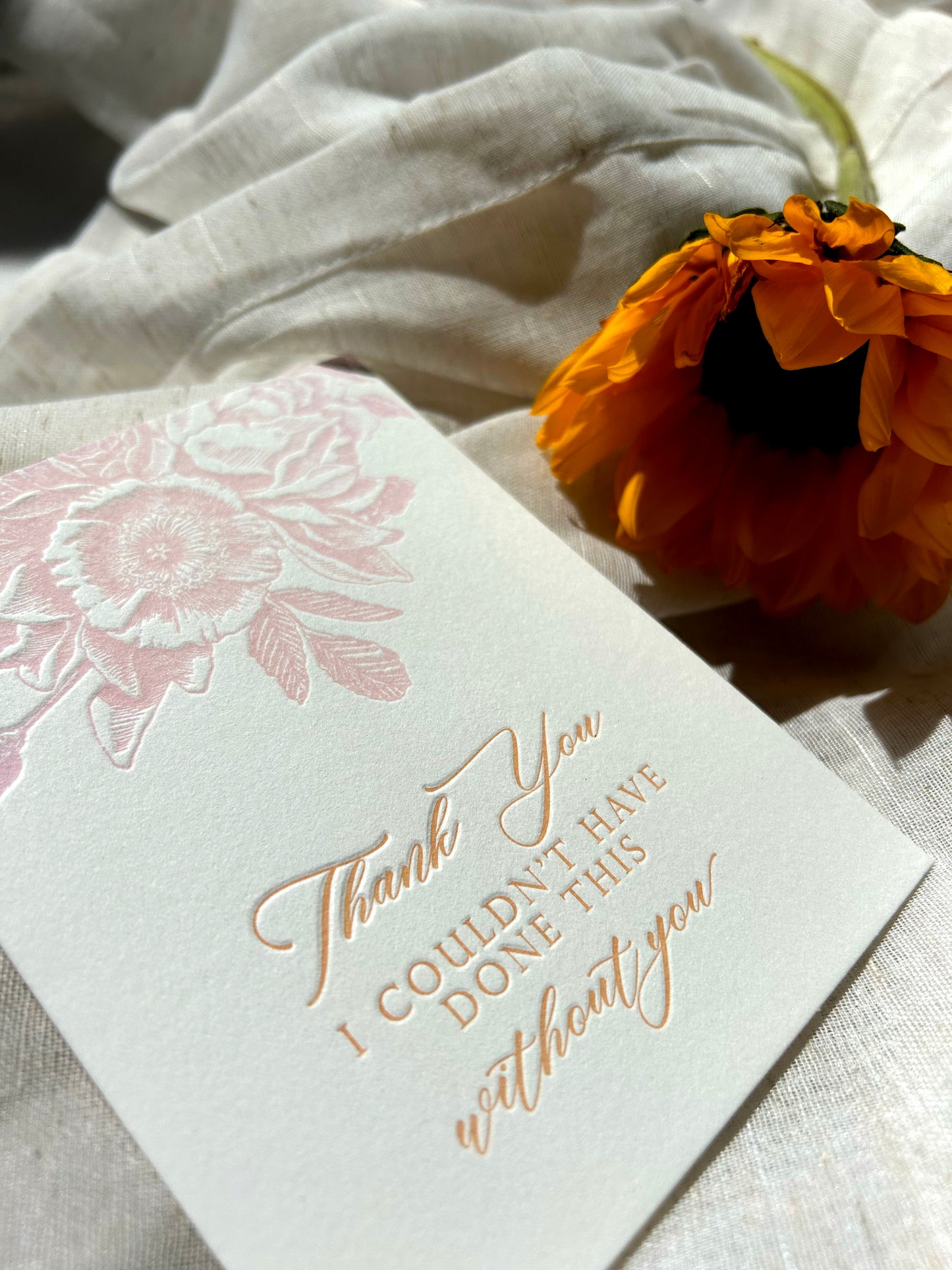 Up close picture of letterpress thank you card with florals that says "Thank you I couldn't have done this without you" by Rust Belt Love