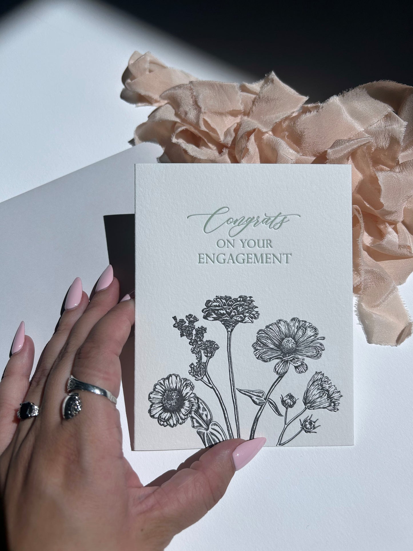 Letterpress congrats card with black florals that says "Congrats on your engagement" by Rust Belt Love