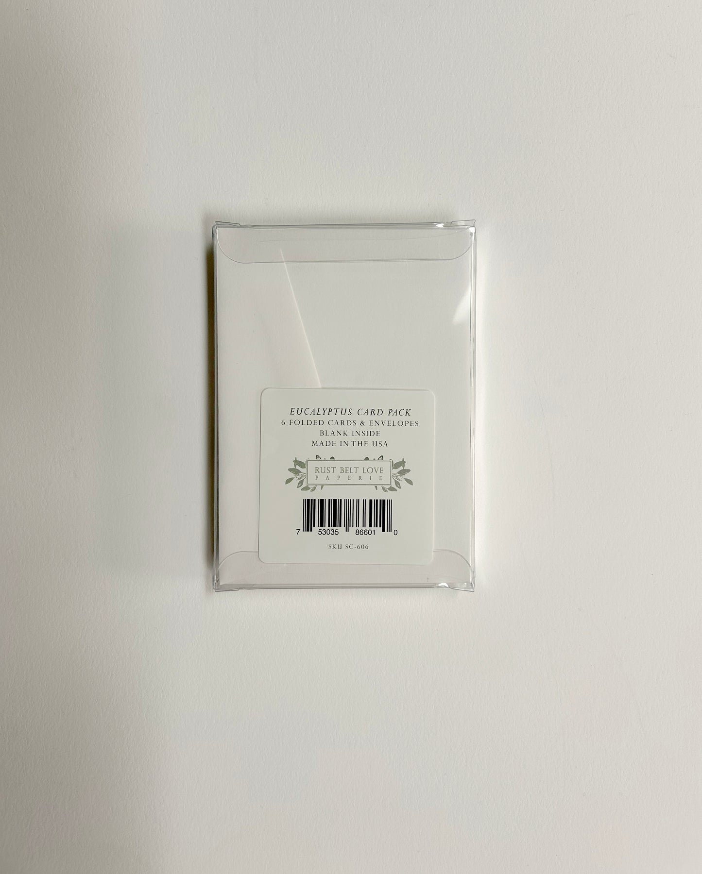 Back of clear plastic box that the small cards come in