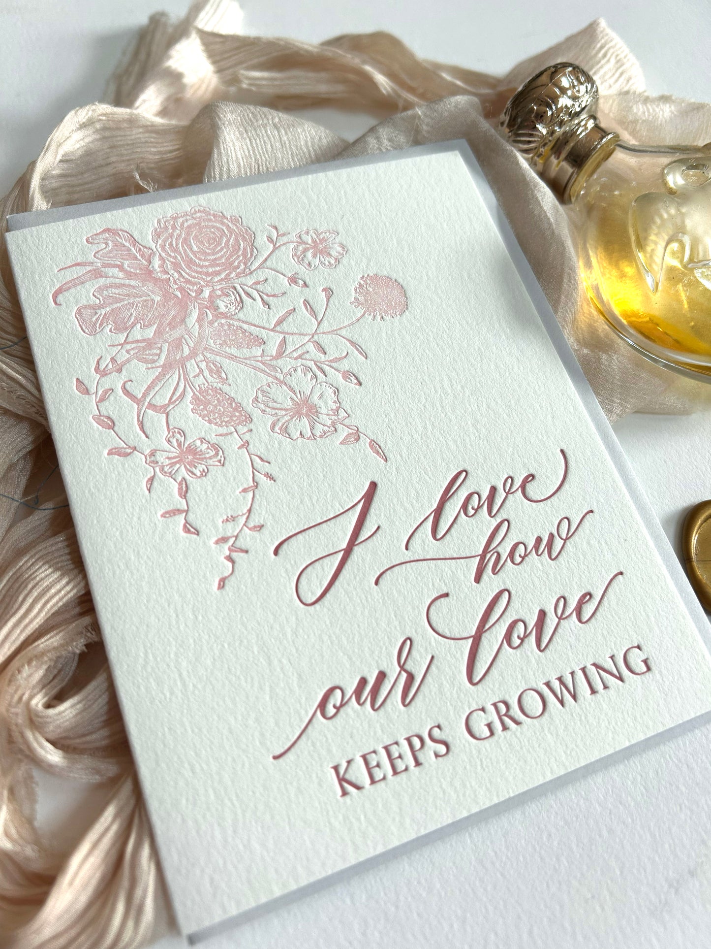 Letterpress love card with florals that reads "I love how our love keeps growing" by Rust Belt Love