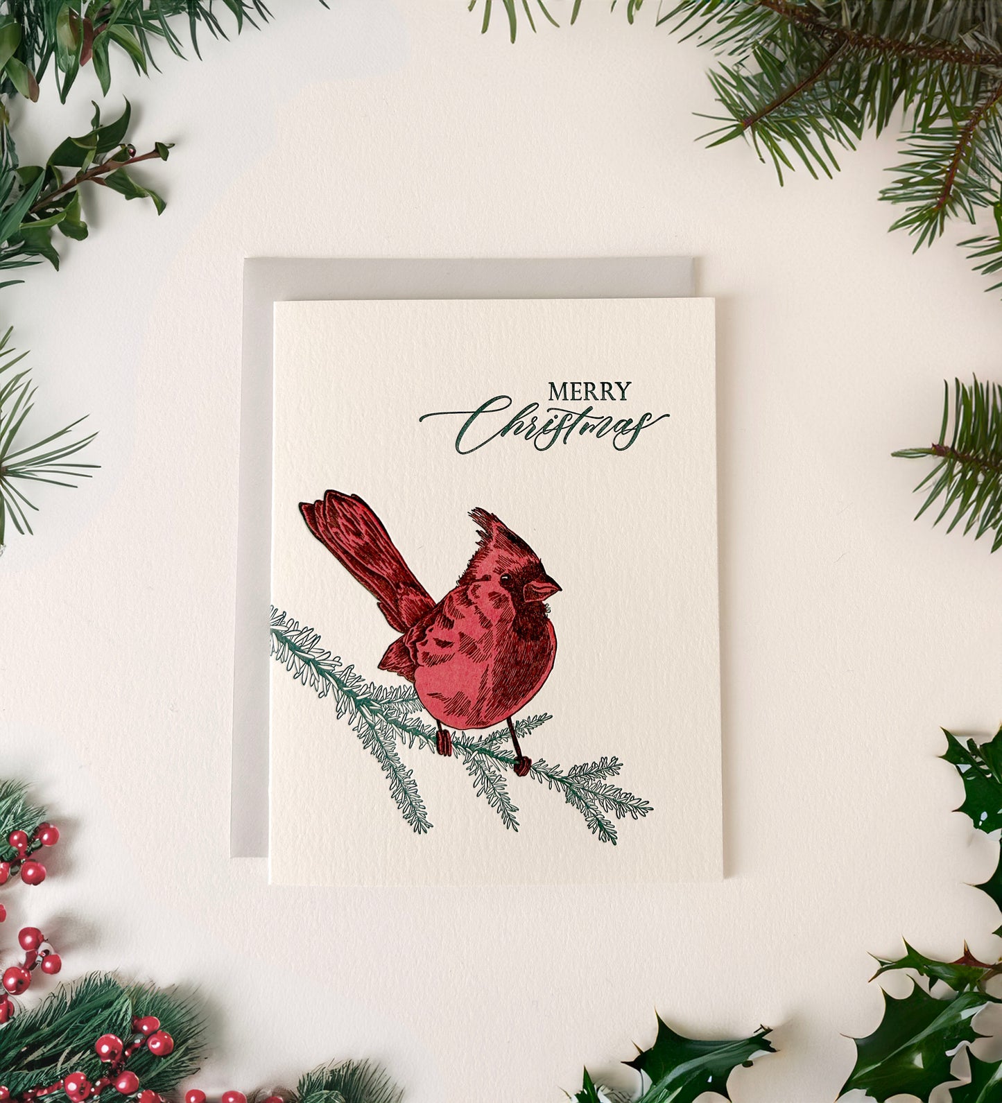Letterpress holiday card with cardinal that says "Merry Christmas" by Rust Belt Love