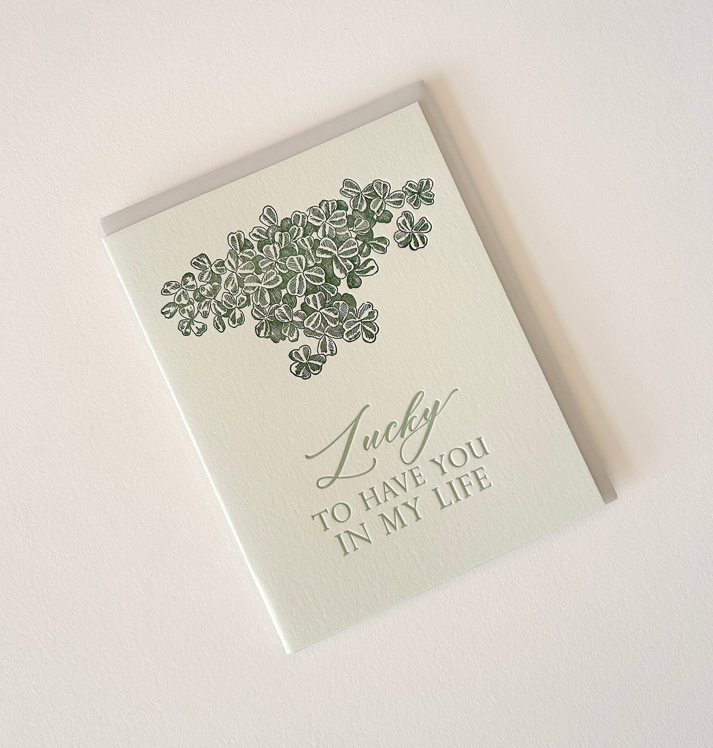 Letterpress card with shamrocks that says "Lucky to have you in my life" by Rust Belt Love