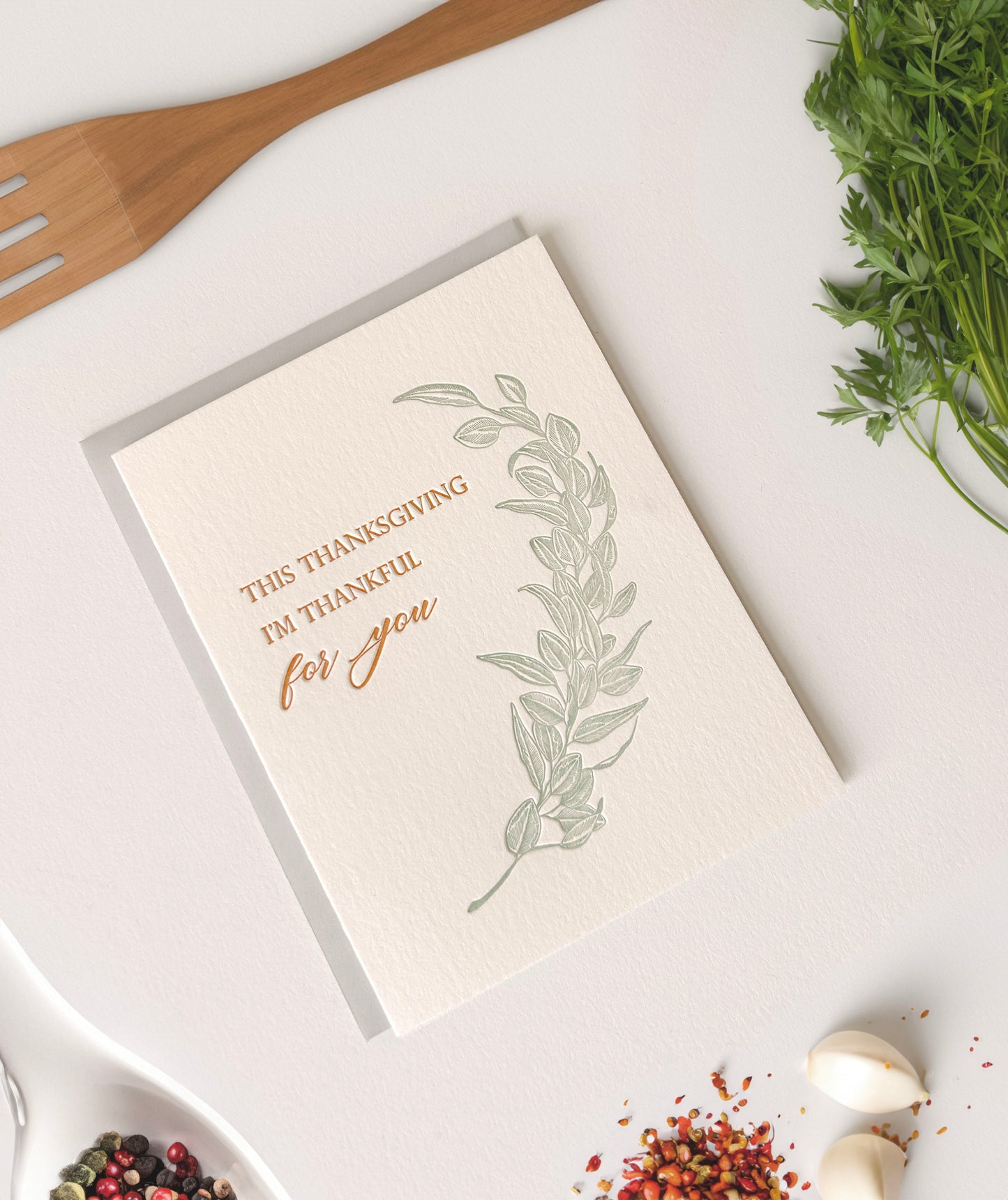 Letterpress thanksgiving card with greenery that says "This Thanksgiving I'm Thankful For You" by Rust Belt Love