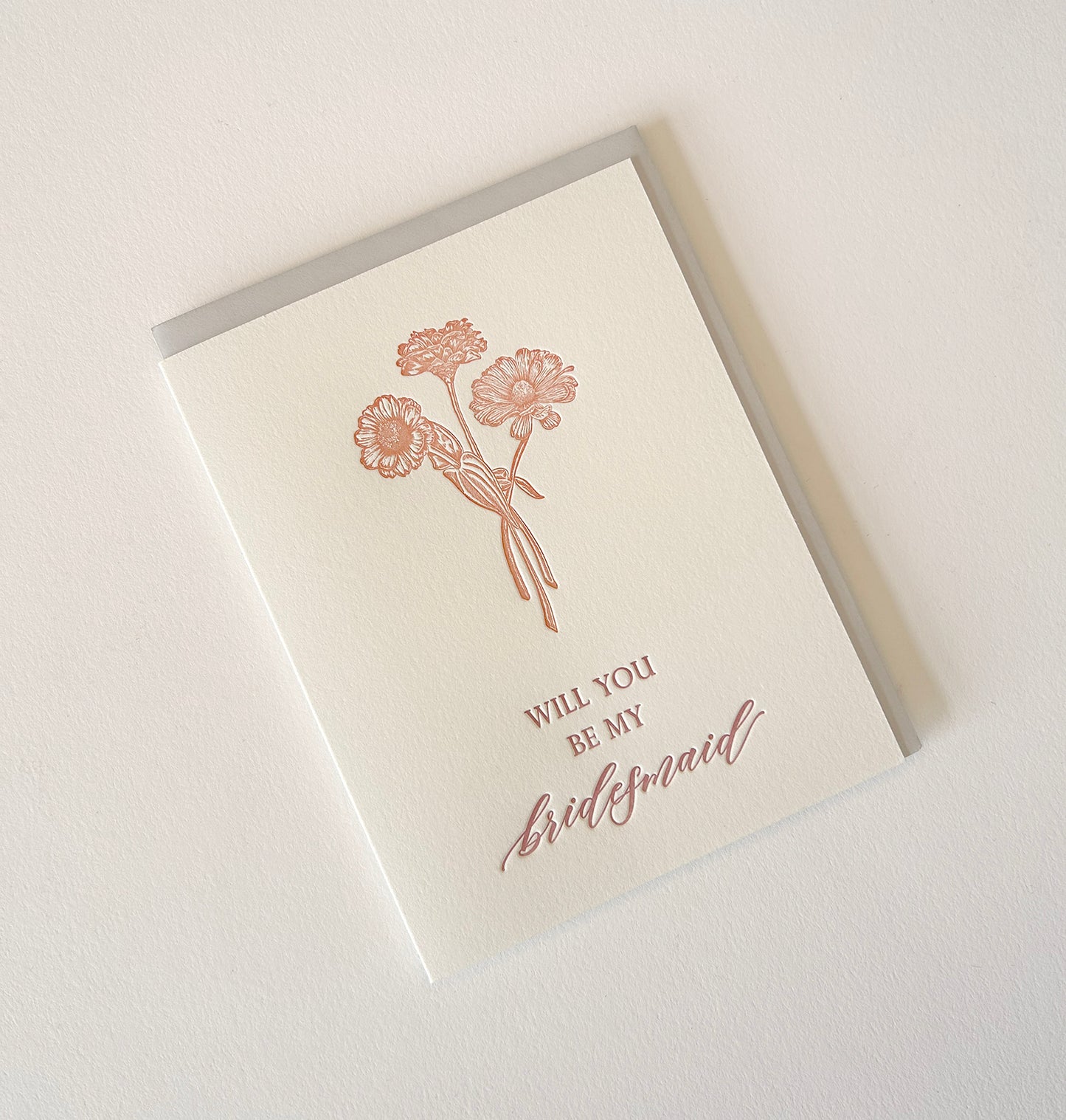 Letterpress wedding card with florals that says " Will You Be My Bridesmaid" by Rust Belt Love