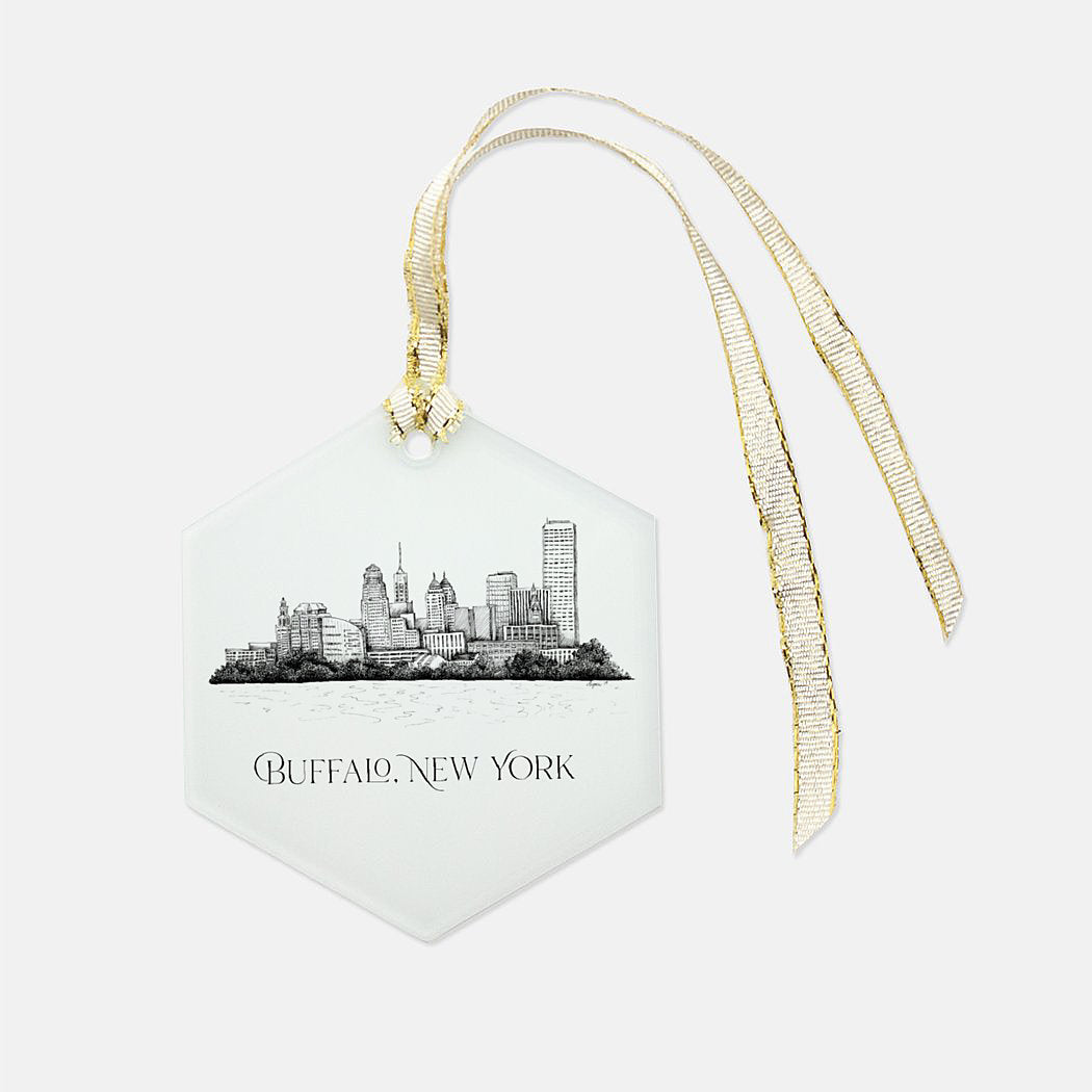 Frosted glass ornament with the buffalo skyline on it that says "Buffalo, New York" with a gold ribbon by Rust Belt Love