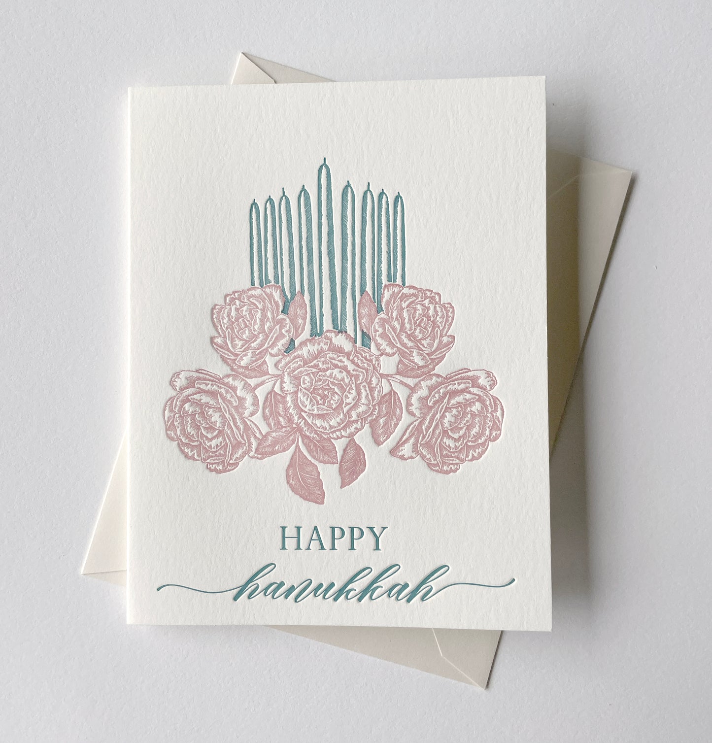 Letterpress holiday card with florals and candles that says "Happy Hanukkah" by Rust Belt Love