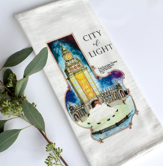 White Tea Towel with electric tower illustration that says "City of Light" by Rust Belt Love