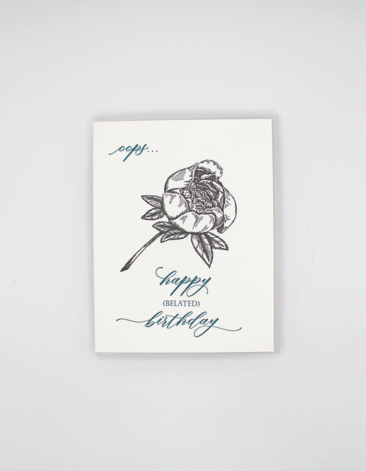 Letterpress birthday card with black floral that reads "oops...happy (belated) birthday" by Rust Belt Love