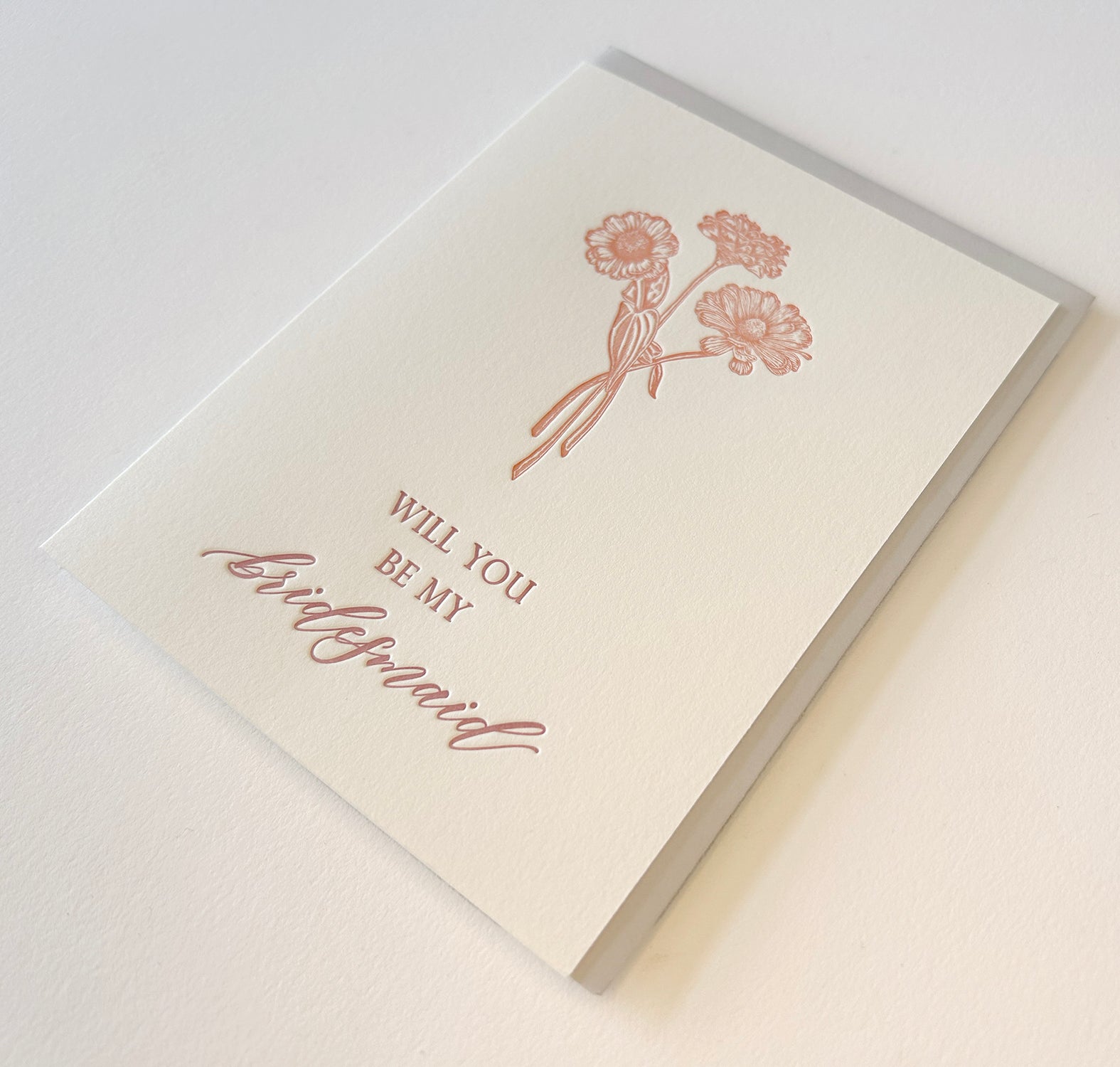 Letterpress wedding card with florals that says " Will You Be My Bridesmaid" by Rust Belt Love