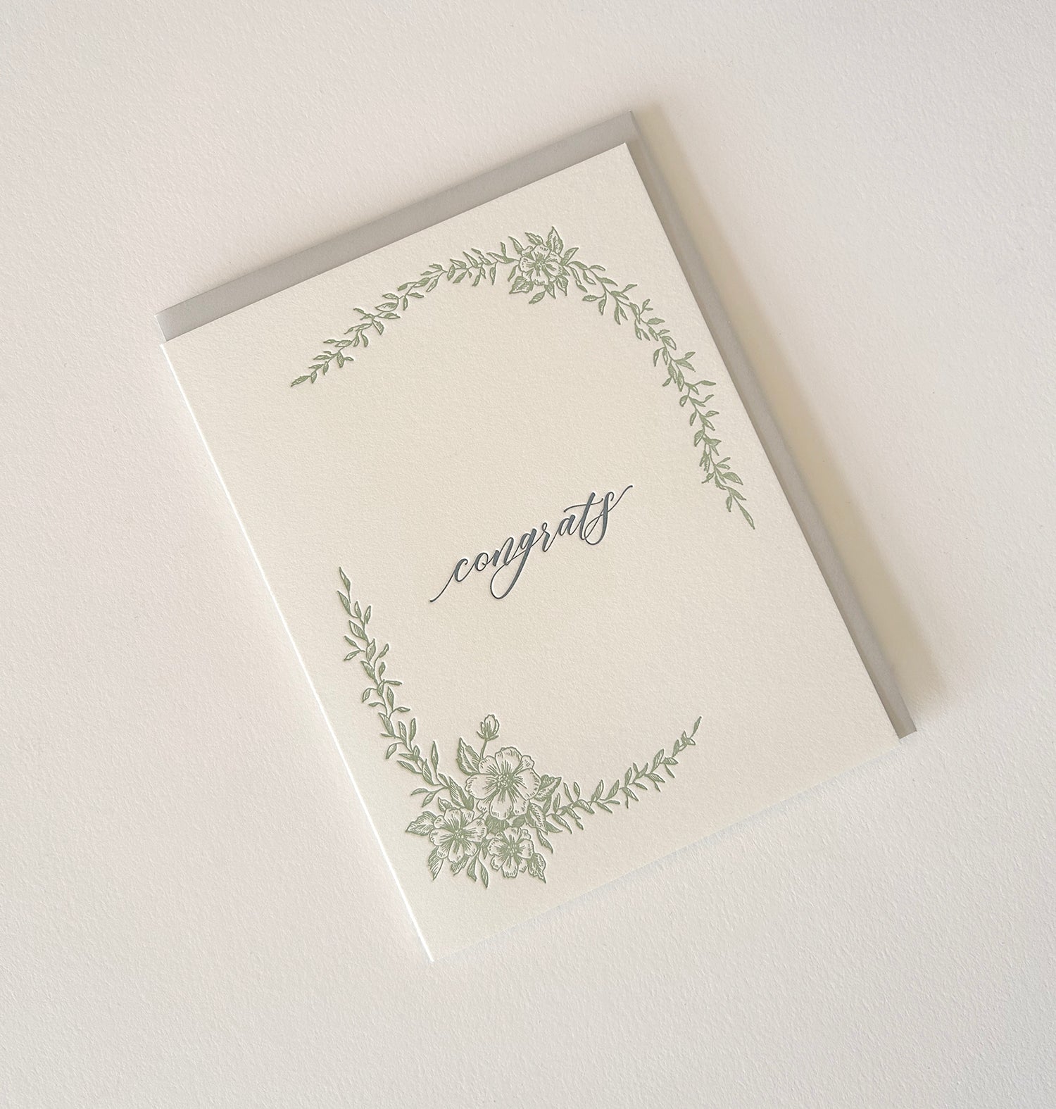 Letterpress congrats card with greenery that says "Congrats" in the middle by Rust Belt Love