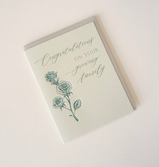 Letterpress congrats card with florals that says "Congratulaions On Your Growing Family" by Rust Belt Love