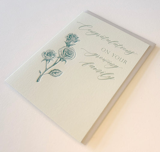 Letterpress congrats card with florals that says "Congratulaions On Your Growing Family" by Rust Belt Love