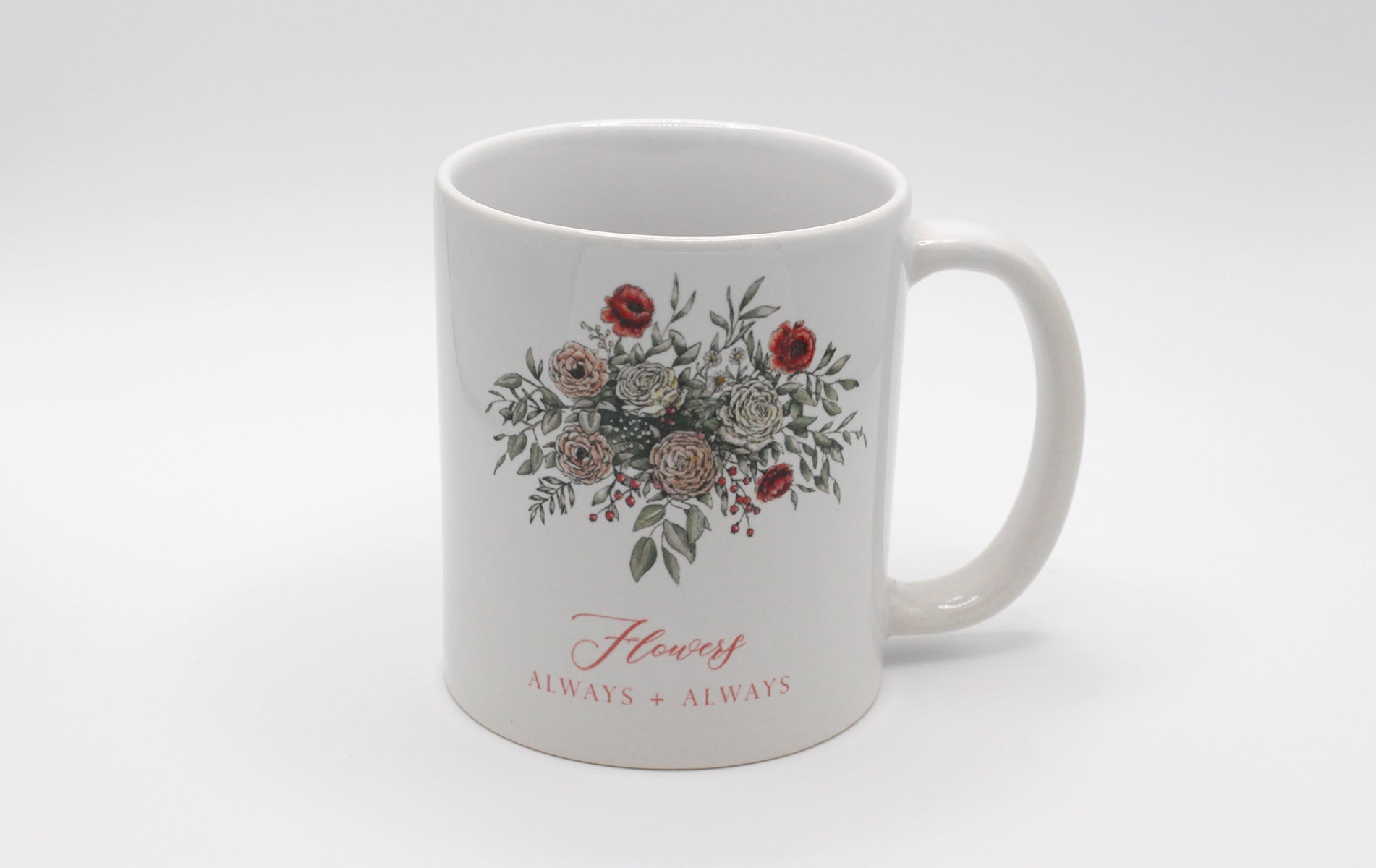 White ceramic mug with floral illustration and the words Flowers Always + Always