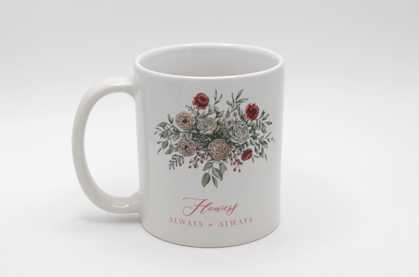 White ceramic mug with floral illustration and the words Flowers Always + Always