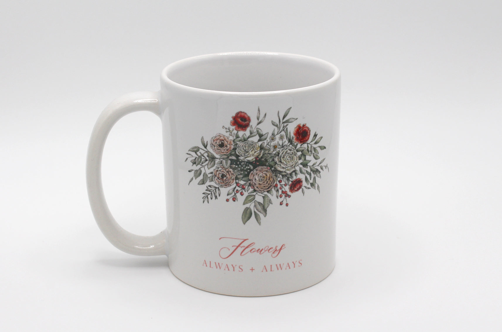 White ceramic mug with floral illustration and the words Flowers Always + Always