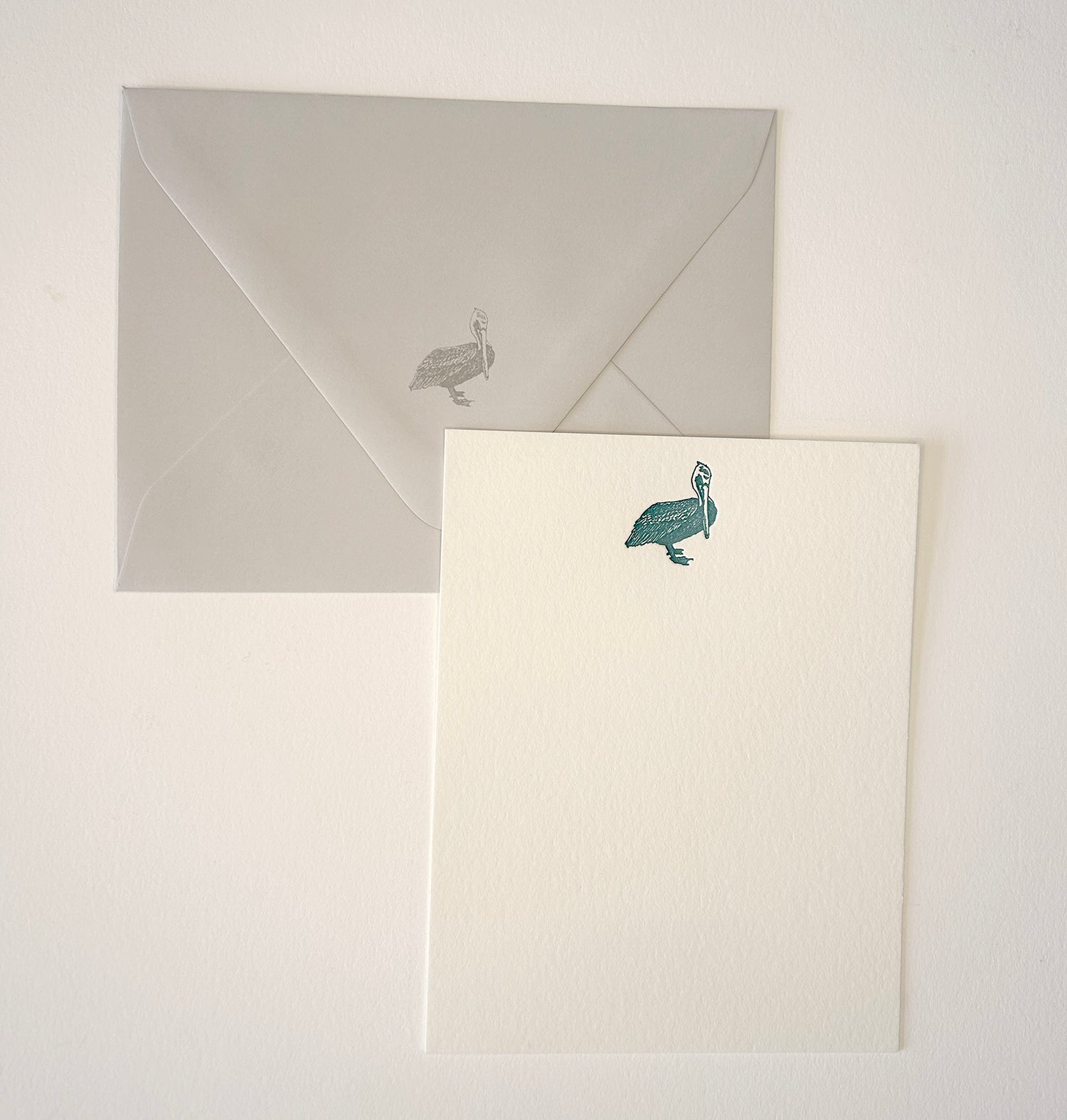 Letterpress flat note card with a teal pelican by Rust Belt Love