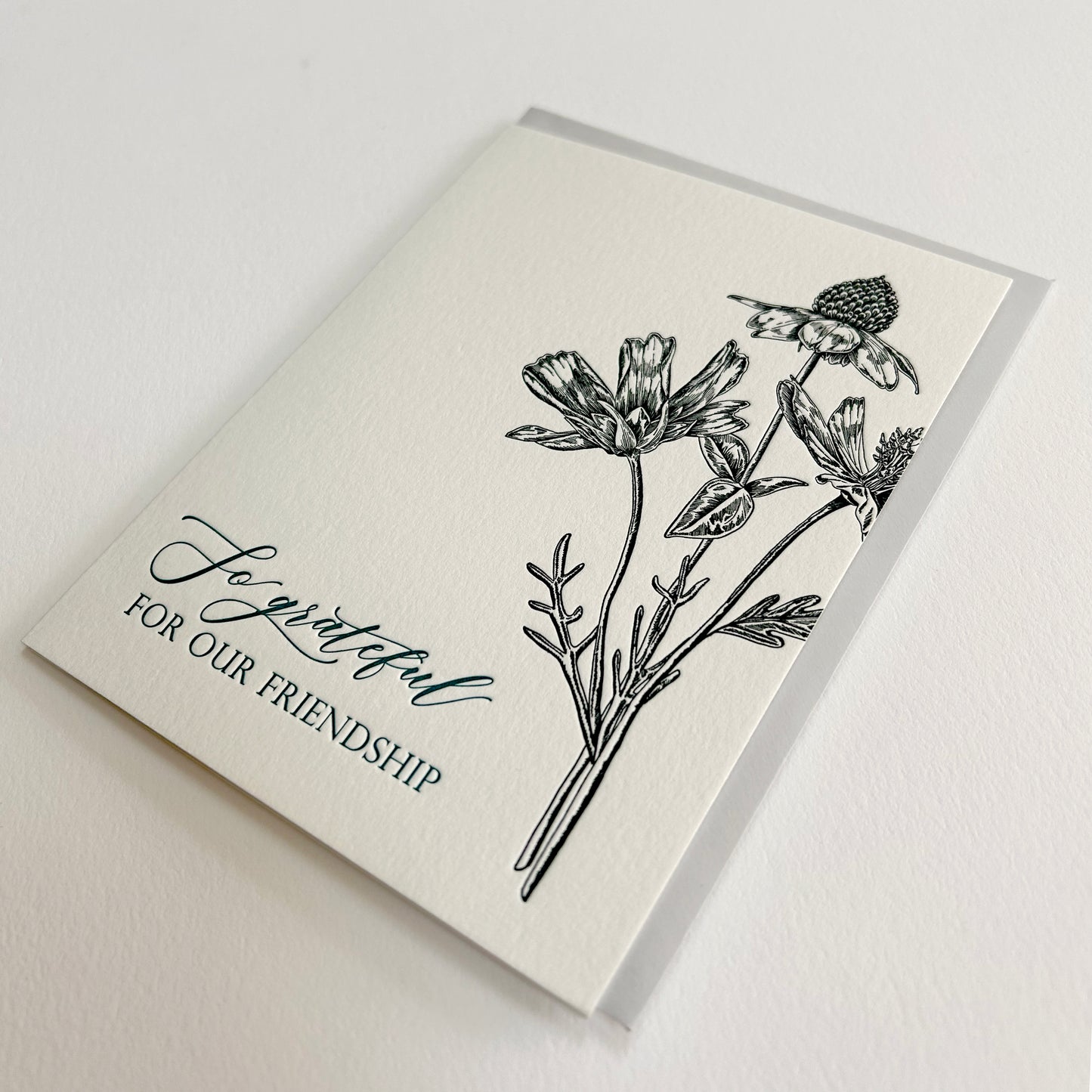 Letterpress friendship card with black florals that reads "So grateful for our friendship" by Rust Belt Love