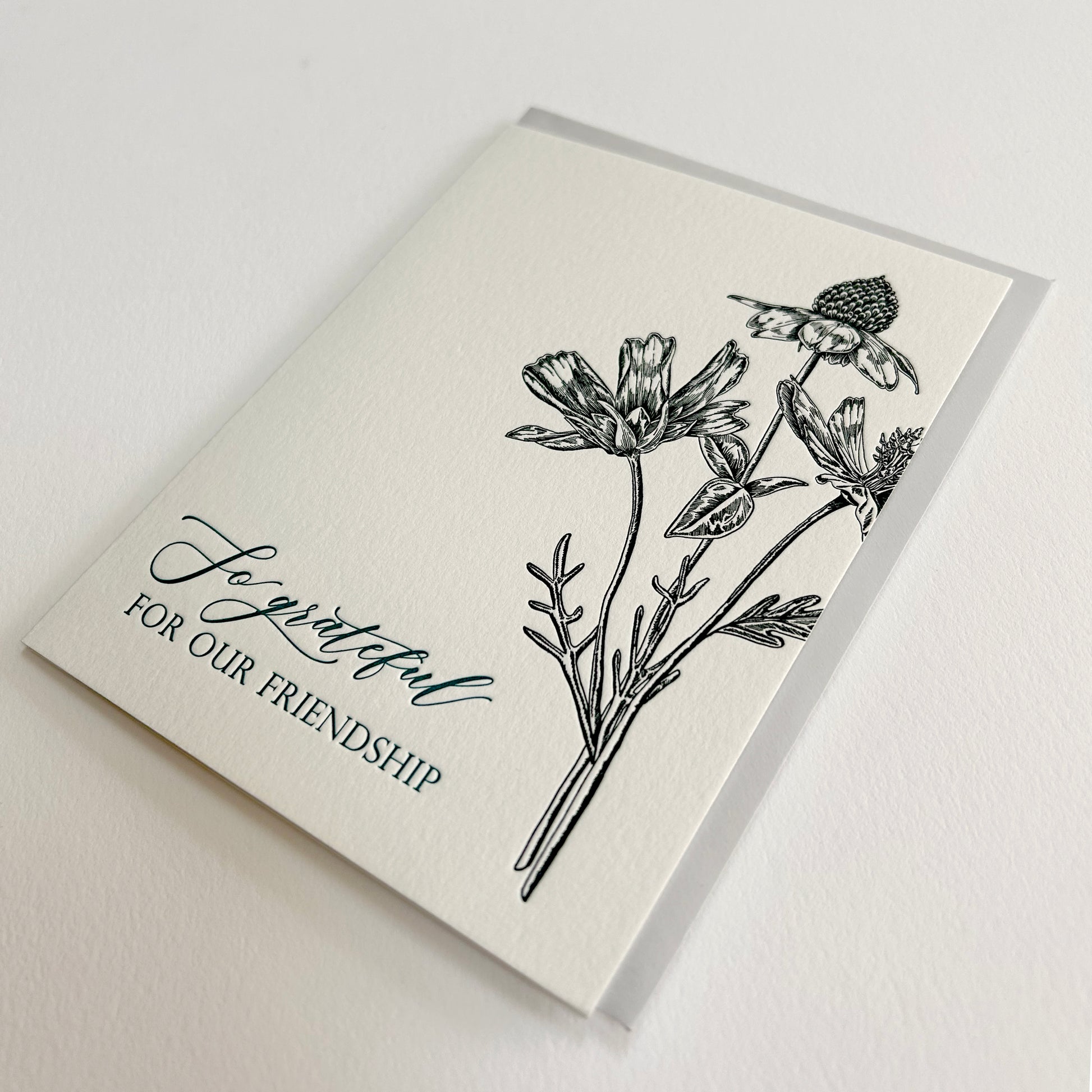 Letterpress friendship card with black florals that reads "So grateful for our friendship" by Rust Belt Love