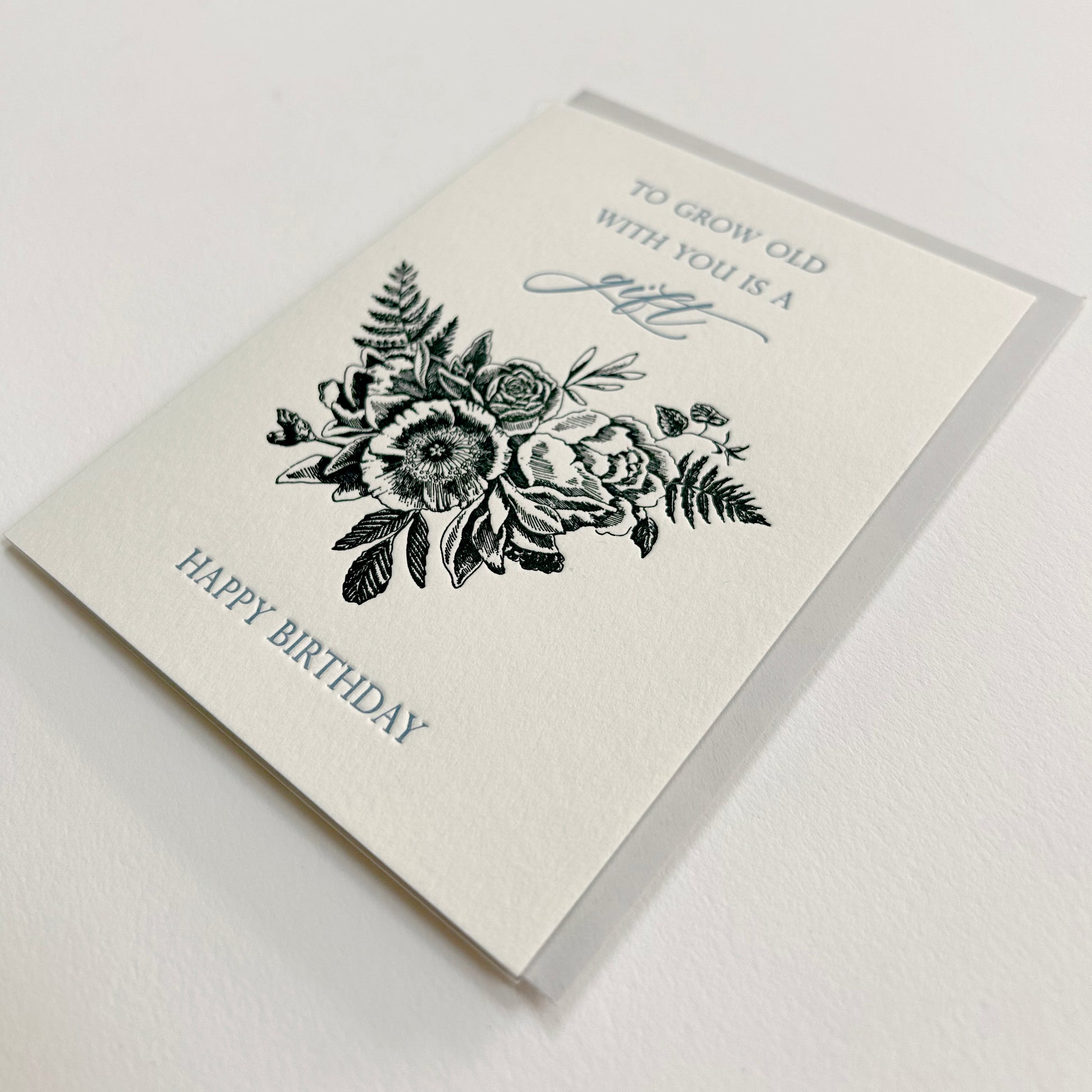 Letterpress birthday card with black florals that reads "To grow old with you is a gift happy birthday" from Rust Belt Love