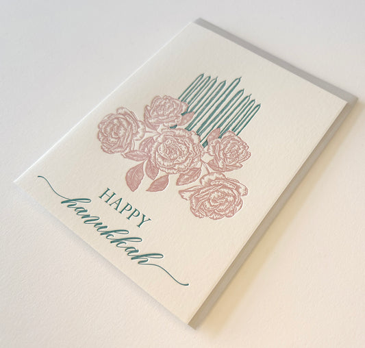 Letterpress holiday card with florals and candles that says "Happy Hanukkah" by Rust Belt Love