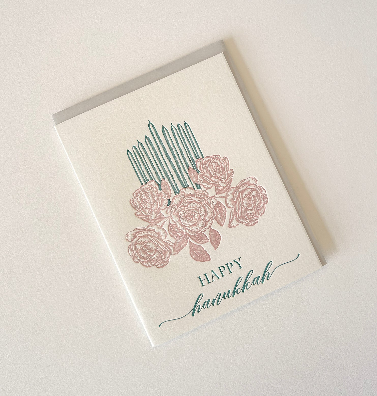 Letterpress holiday card with florals and candles that says "Happy Hanukkah" by Rust Belt Love