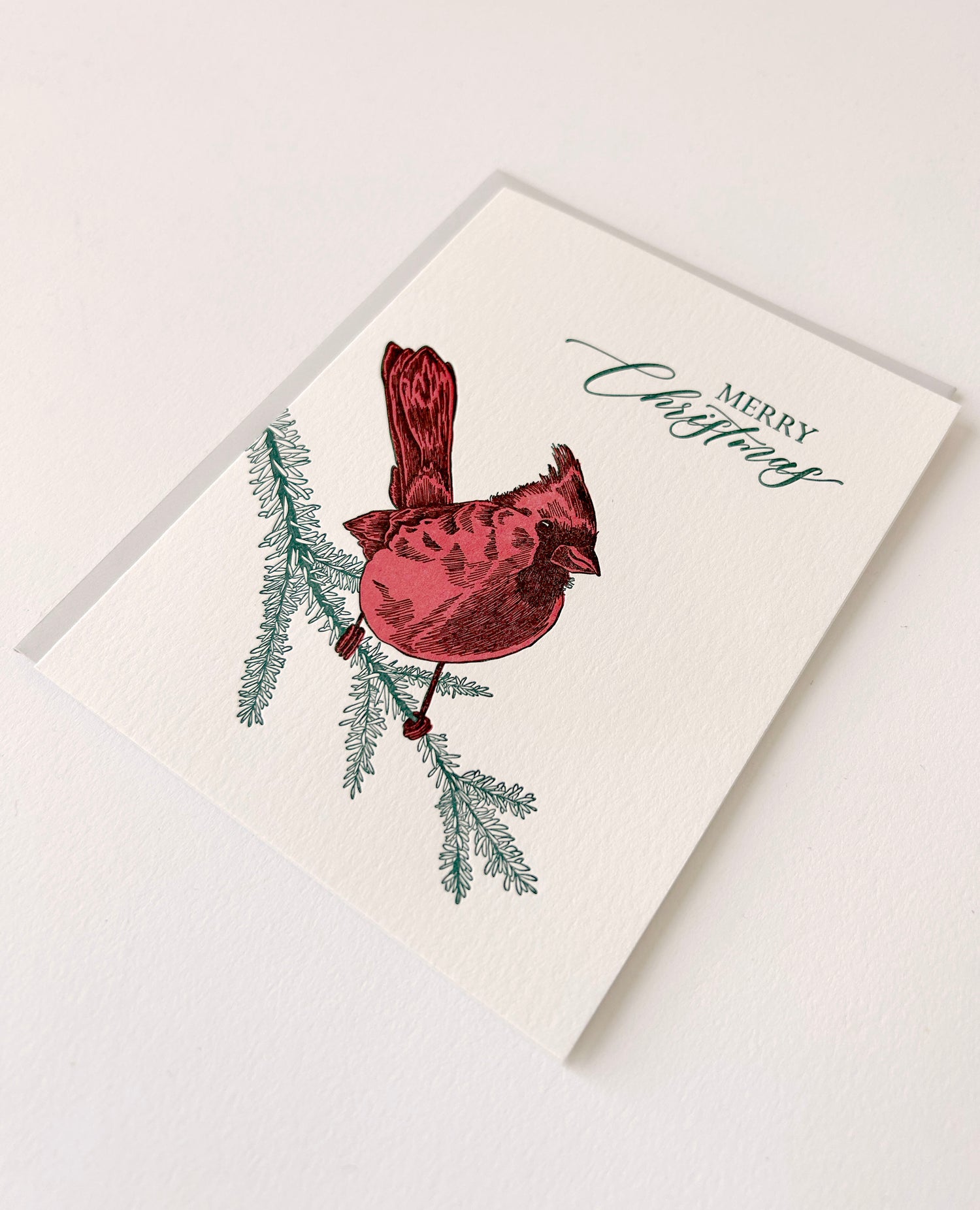 Letterpress holiday card with cardinal that says "Merry Christmas" by Rust Belt Love