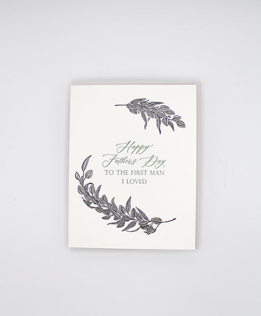 Letterpress father's day card with black greenery that reads "Happy Father's Day to the first man I loved"by Rust Belt Love