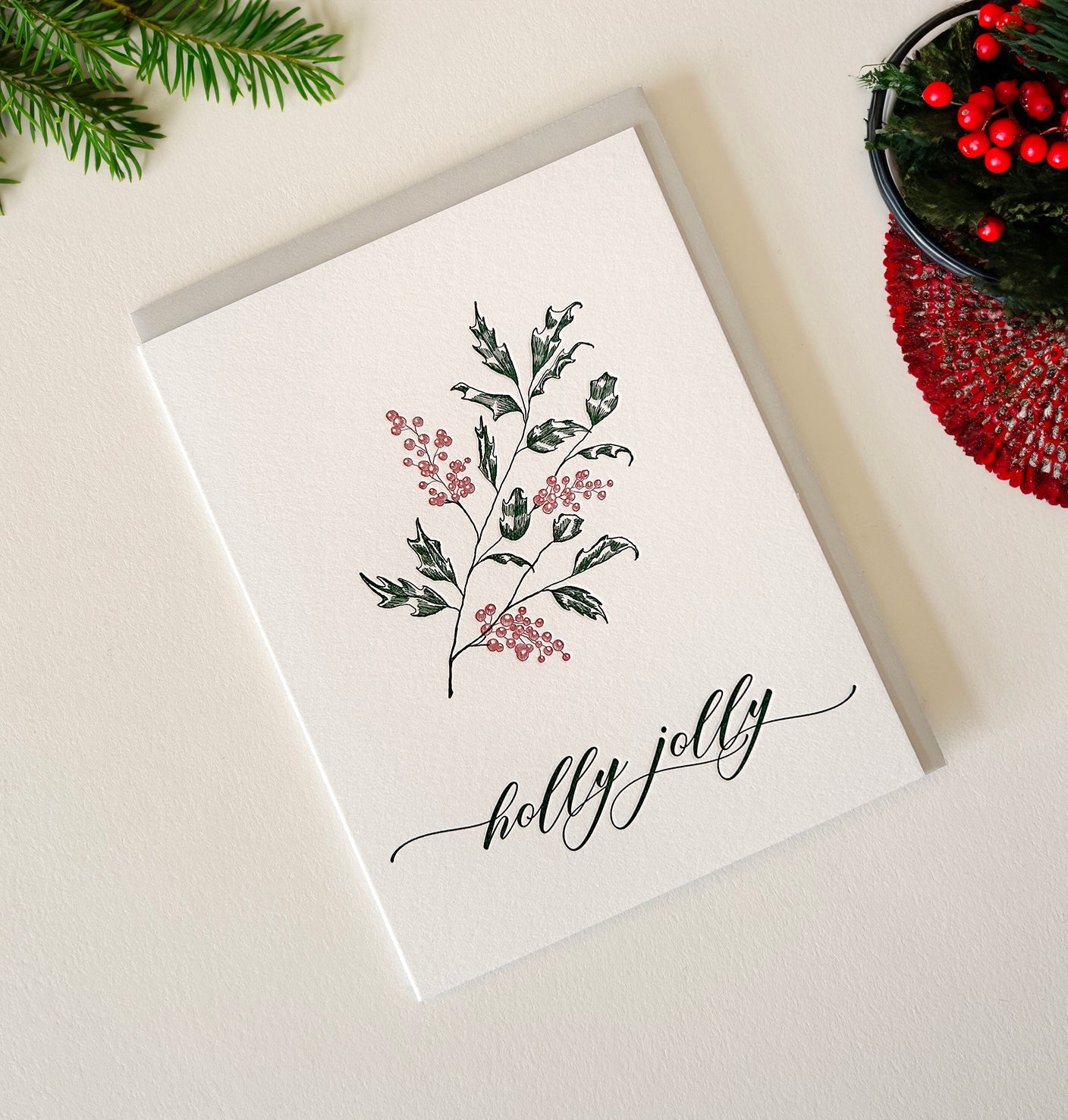 Letterpress holiday card with holly that says "holly jolly" by Rust Belt Love
