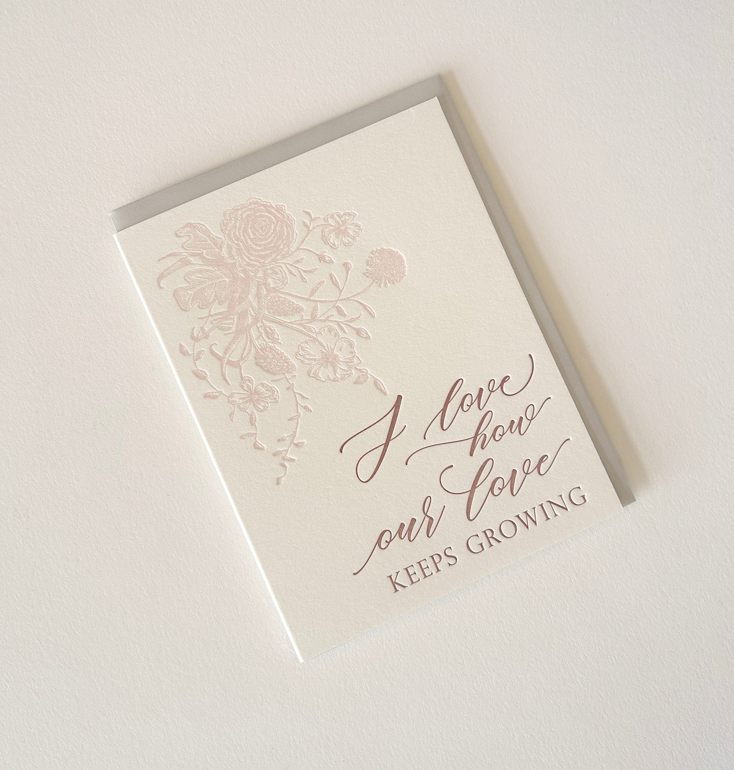 Letterpress love card with florals that says "I love how our love keeps growing" by Rust Belt Love