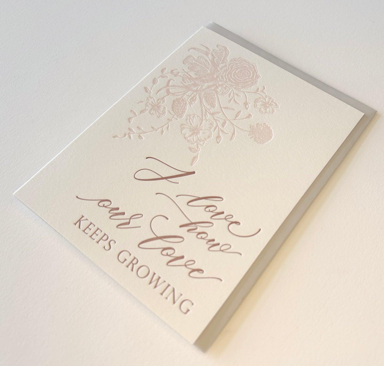 Letterpress love card with florals that says "I love how our love keeps growing" by Rust Belt Love