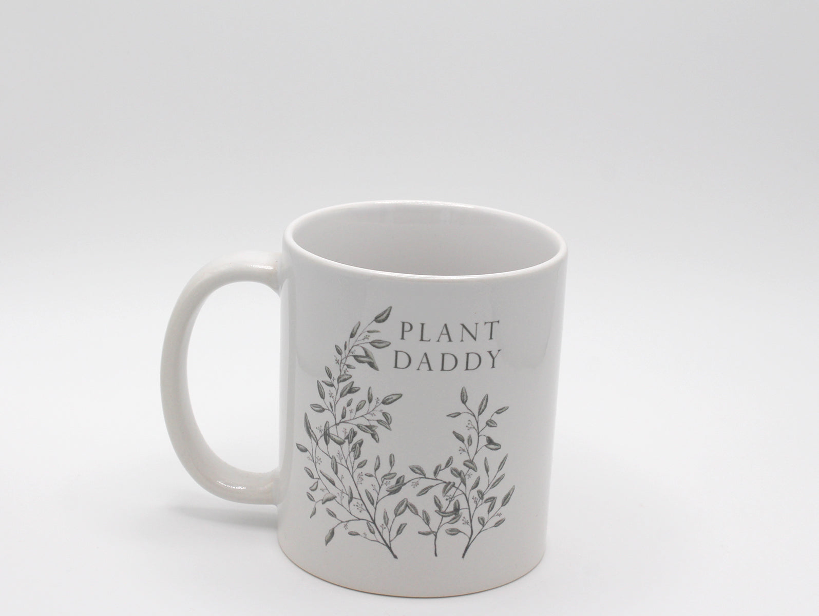 White ceramic mug with greenery that says "Plant daddy" by Rust Belt Love