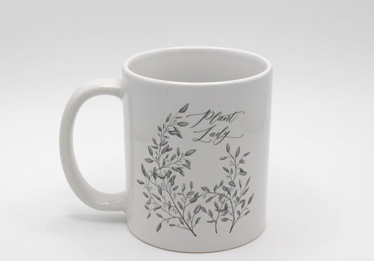 White ceramic mug with drawing of leafy greenery and words "Plant Lady" by Rust Belt Love