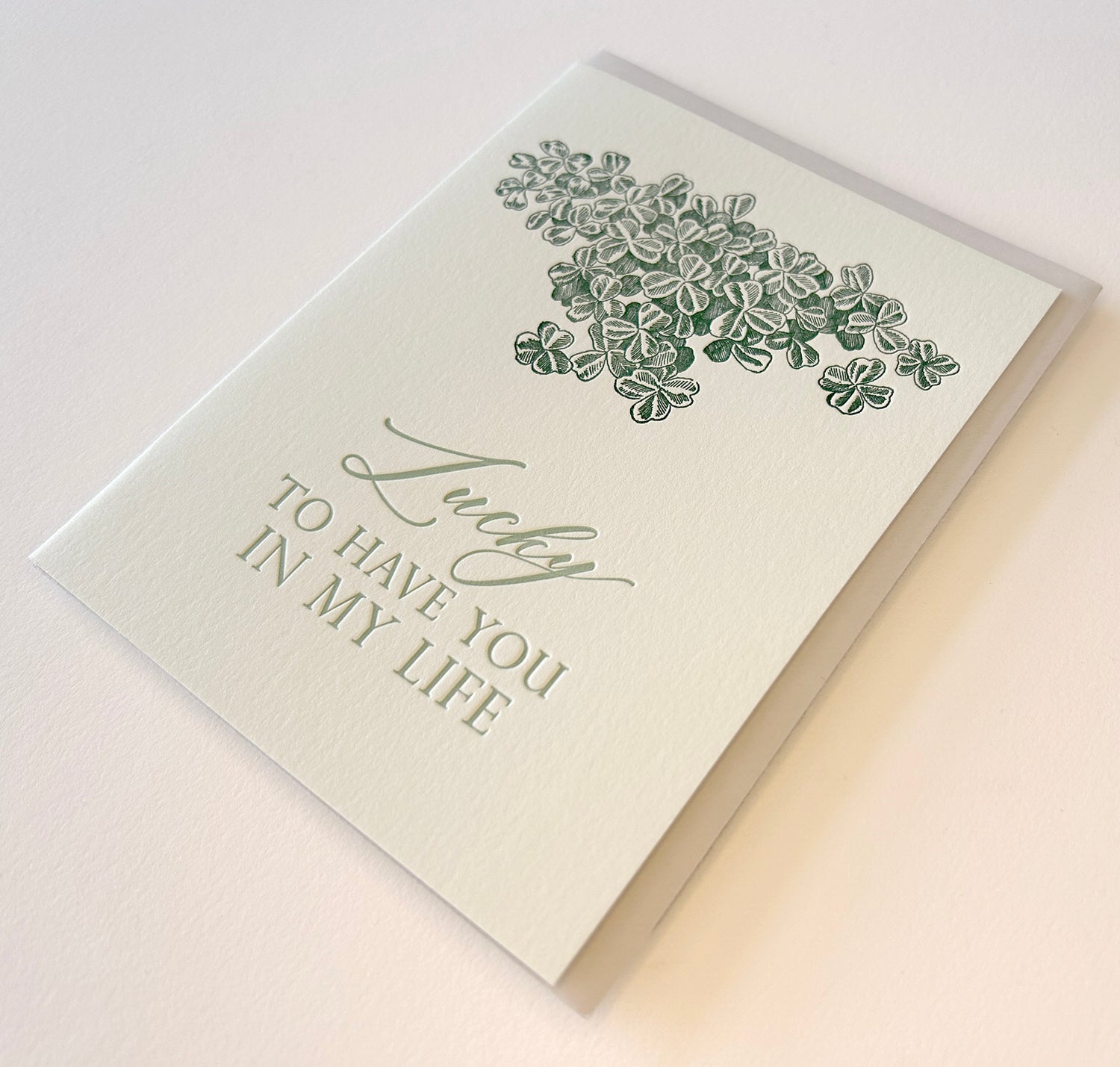 Letterpress card with shamrocks that says "Lucky to have you in my life" by Rust Belt Love