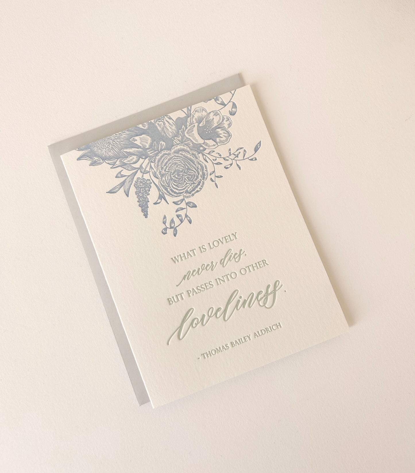 Letterpress sympathy card with florals that says "What is lovely never dies, but passes into other loveliness. - Thomas Bailey Aldrich" by Rust Belt Love