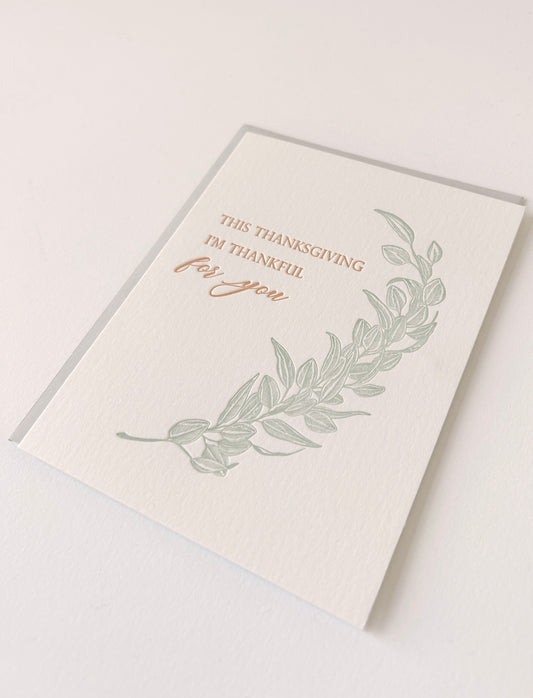Letterpress thanksgiving card with greenery that says "This Thanksgiving I'm Thankful For You" by Rust Belt Love