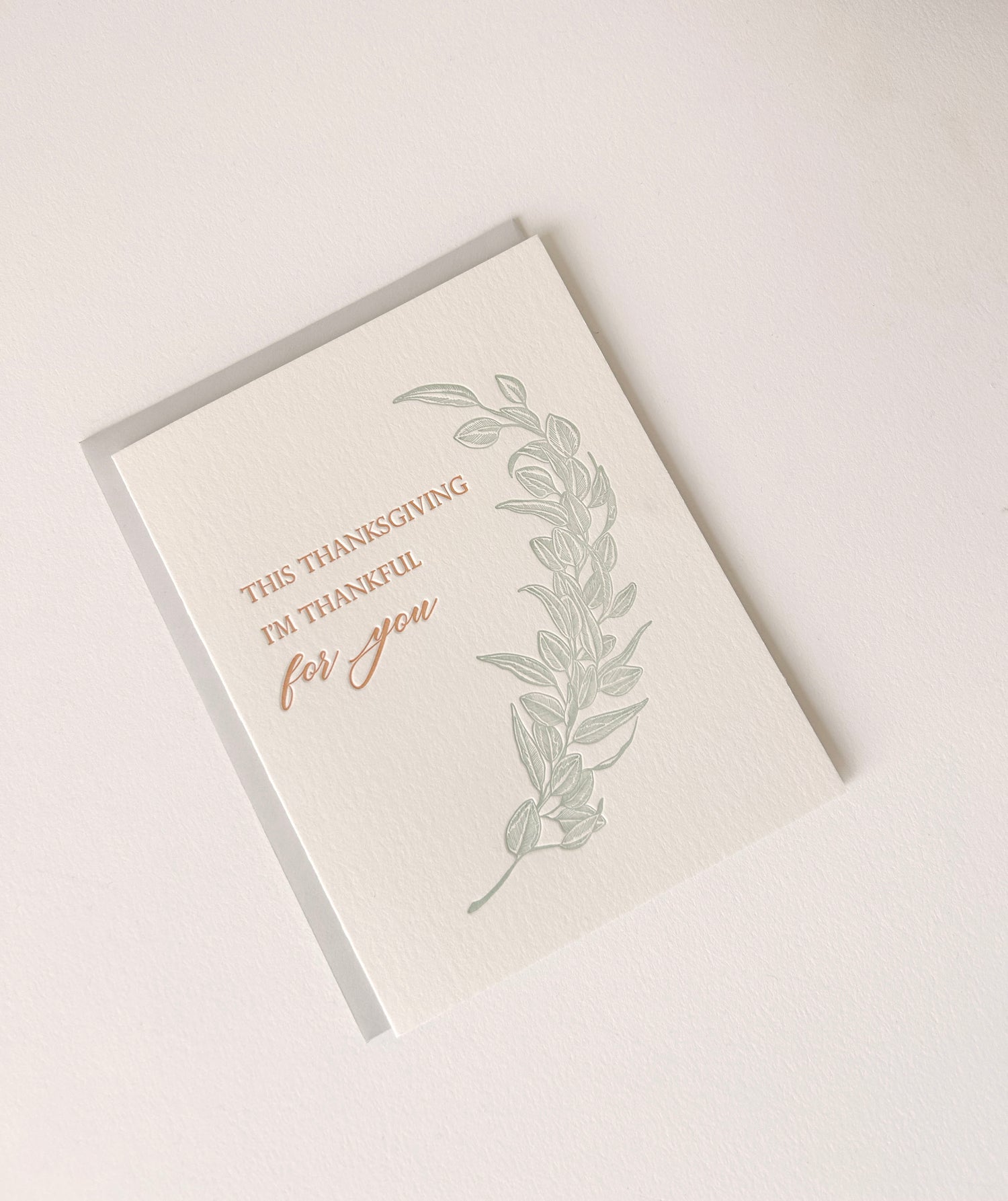 Letterpress thanksgiving card with greenery that says "This Thanksgiving I'm Thankful For You" by Rust Belt Love