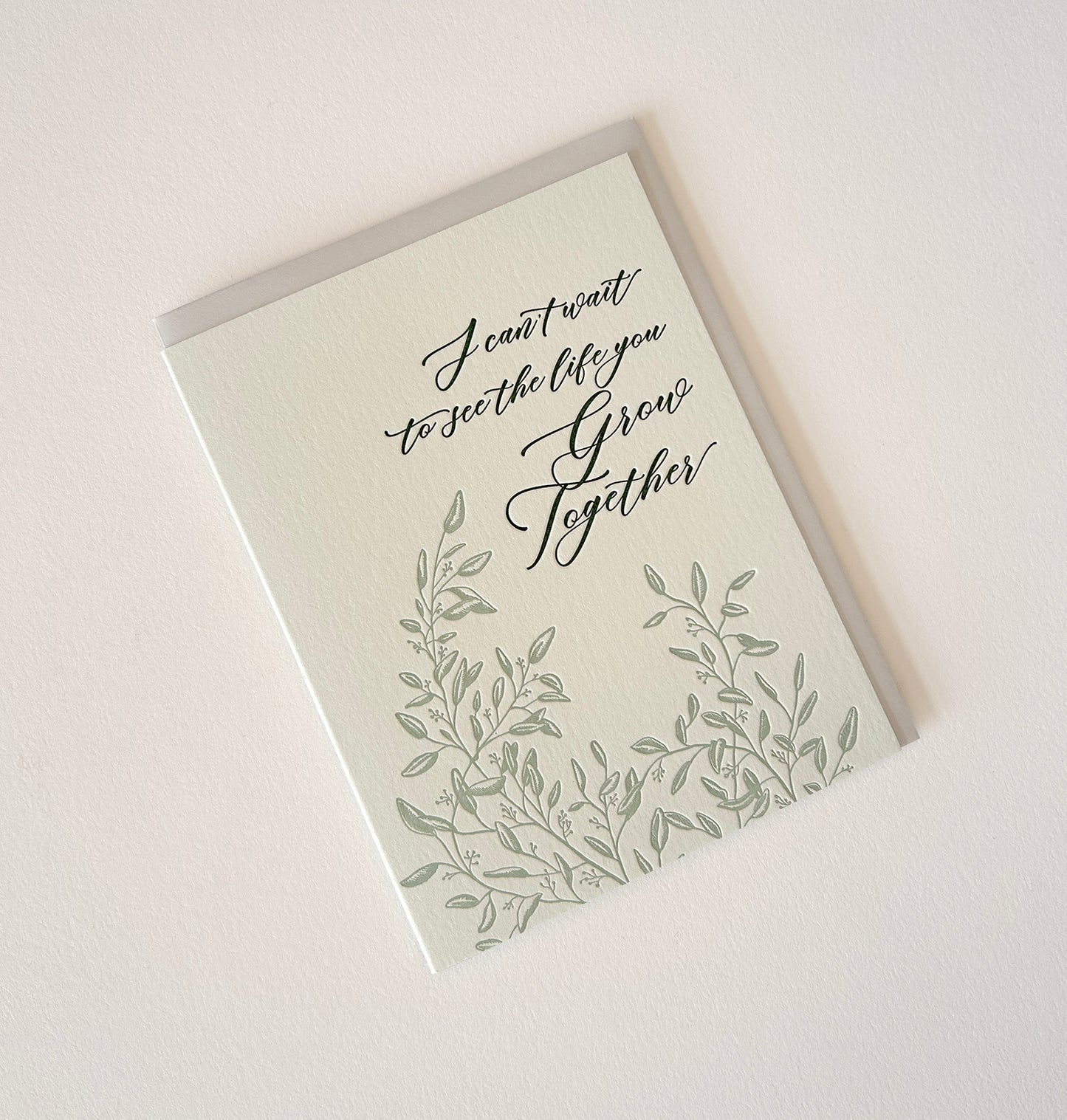 Letterpress wedding card with florals that says "I can't wait to see the life you grow together" by Rust Belt Love