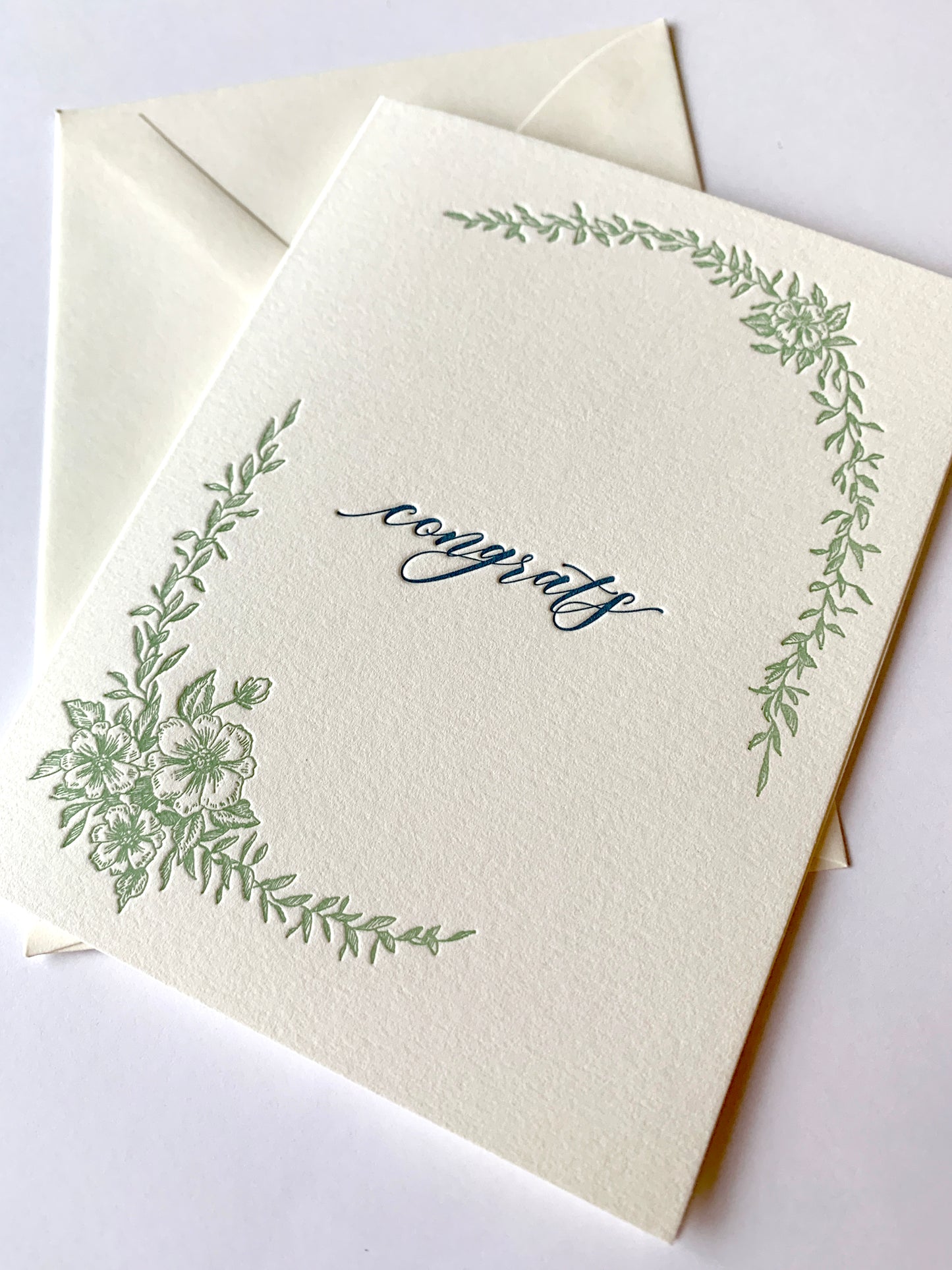 Letterpress congrats card with greenery that says "Congrats" in the middle by Rust Belt Love