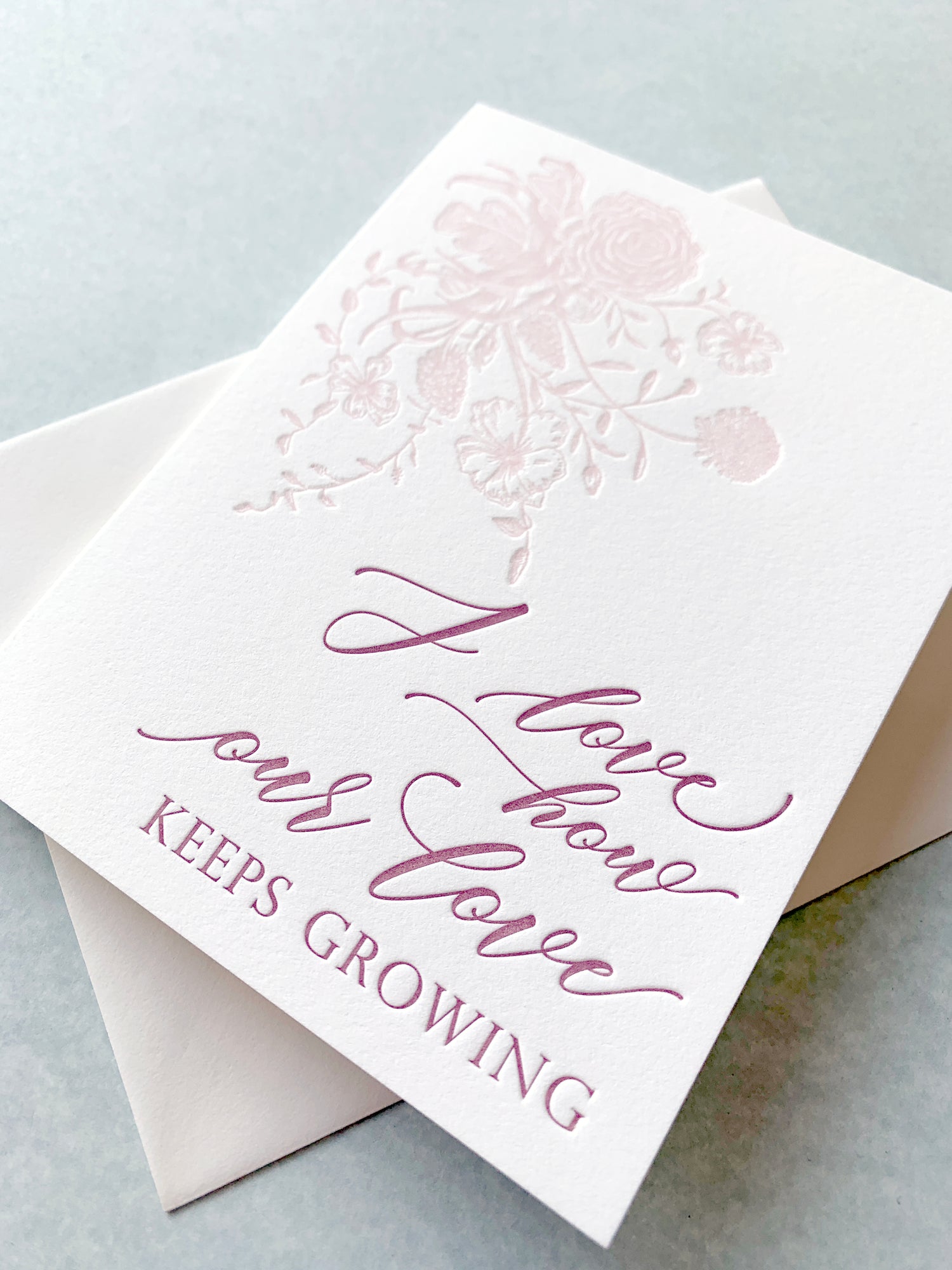 Letterpress love card with florals that says "I love how our love keeps growing" by Rust Belt Love