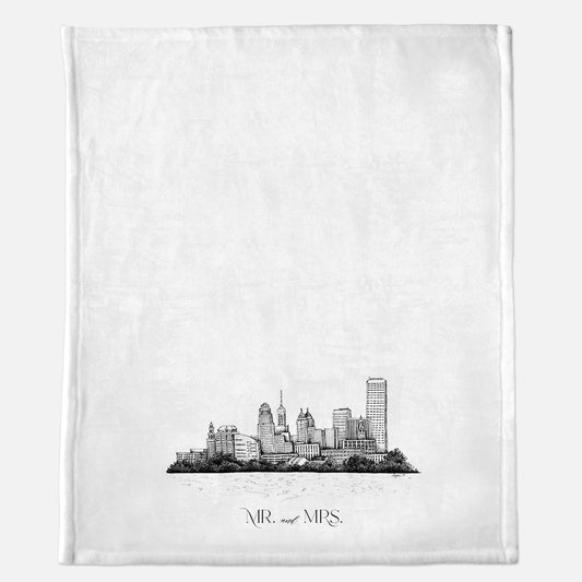 White minky blanket with Buffalo Skyline illustration that says "Mr. and Mrs." by Rust Belt Love