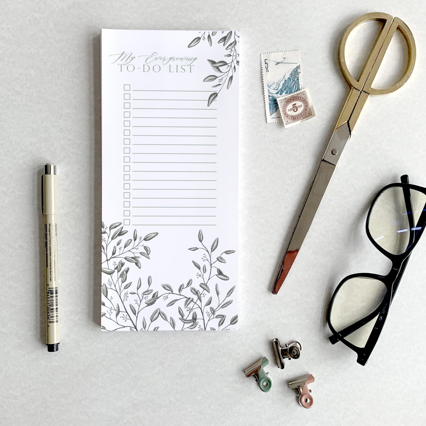 3.5 by 8.5 notepad with lined sheets with florals that says "My ever-growing to-do list" by Rust Belt Love