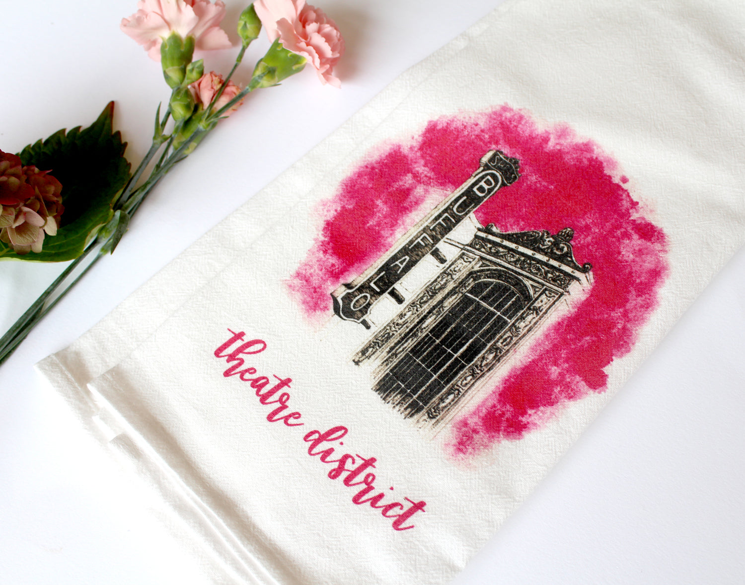 White Tea Towel with Shea's illustration that says "theatre district" by Rust Belt Love